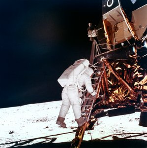 Edwin Buzz Aldrin descends the steps of the Lunar Module ladder to walk on the Moon