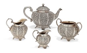 Repousse four-piece tea set, late 19th century by Oomersi Mawji