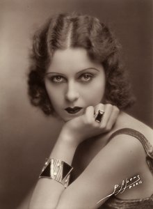 Close-up of a young woman resting her chin on her hand by P. Apers