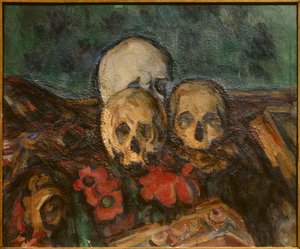 Three skulls on an oriental rug by Paul Cézanne