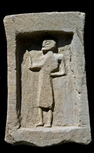 Punic Funerary Stele with Relief of Walking Character by Phoenician Phoenician