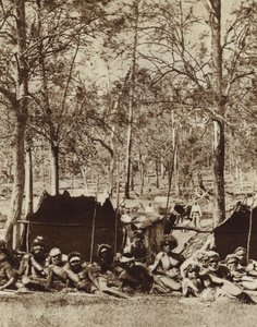 Australian Aborigines sheltering behind a windbreak by Photographer Australian