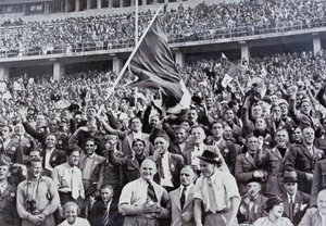 Italian fans supporting their athletes in the stadium at the Olympic Games, Berlin, Germany by Photographer German