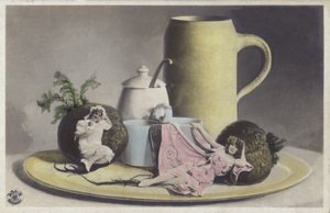 Tiny girls on a tray of crockery by Photographer German