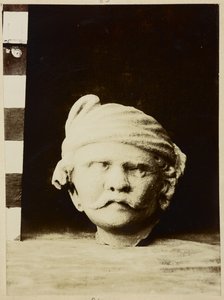 Taxila, Chir Tope [Dharmarajika Stupa]. Stucco Head by Photographer Indian