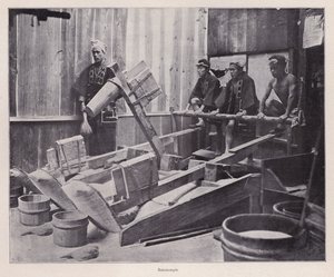 Dehulling rice or making rice flour using a rice pounder, Japan by Photographer Japanese