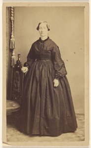 Unidentified woman, standing