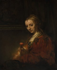 Woman with a Pink by Rembrandt van Rijn