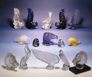 Various glass car mascots (of birds, fish, horses and a human head) by Rene Jules Lalique