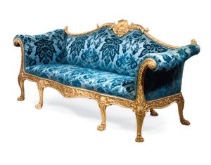 A George III giltwood sofa by Robert Adam
