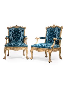A pair of George III giltwood armchairs