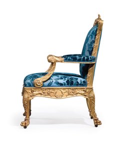 One of a pair of George III giltwood armchairs
