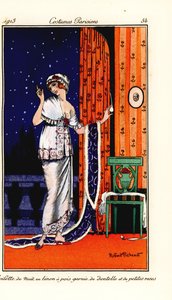 Woman in evening gown of polka-dot linen decorated with lace and roses