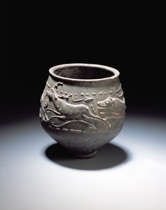 Beaker decorated with a hunt scene showing stag, hind and hounds, from the Roman site at Newstead, Melrose, AD 140-80