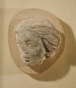 Relief depicting the head of a woman, from Tunisia