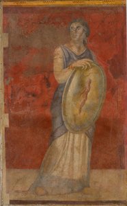 Standing woman holding a shield