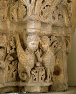 Top decorates sirens and birds on the model of those of the Church Saint Loup de Naud by Romanesque