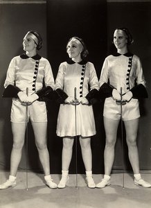 Portrait of Three Female Gymnasts in Fencing Clothes