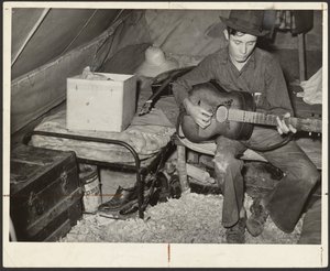 White Migrant Strawberry Picker on Bed in Tent Near Hammond, Louisiana
