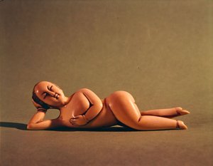 Figurine of woman used by sick patient to show doctor the affected area