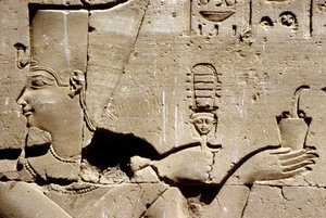 Wall painting/carving, The pharaoh Ptolemy shaking a systrum and offering incense, Temple of Horus, Edfu by School Egyptian