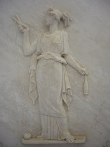 Bas relief of Atropos cutting the thread of Life by School Greek