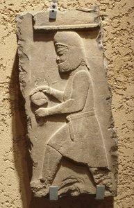 A Mede at the Royal Court of Persepolis carrying a covered vessel by School Iranian