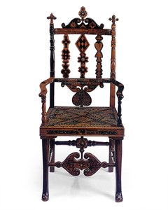 Inlaid and carved open armchair encoded with a patchwork of various phrases