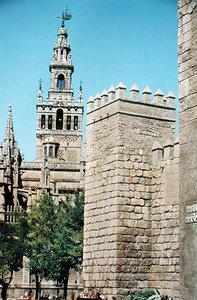 View of La Giralda Tower and one of the towers of the Reales Alcazares