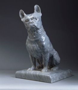 A grey marble figure of a pug