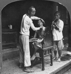 A Chinese Barber at Bhamo, Burma, 1908