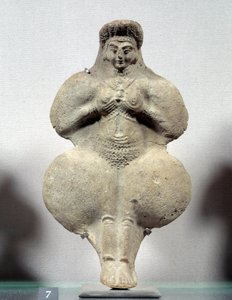 Terracotta statuette of woman holding her breasts, probable representation of Ishtar, goddess of fertility. From Susa. Iran. Elamite period. 14th-12th century BC. Louvre Museum by Sumerian Sumerian