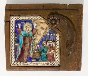 A signed and dated Syrian ceramic tile, painted in manganese, blue and brown, dated 1699