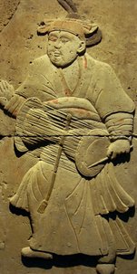 Terracotta stele with musician, Tang Dynasty (618-907), discovered in Shaanxi Province, Steles Forest Museum in Xian. Photography, Leonard de Selva, China, 2006.