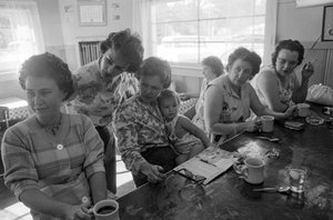 Women at a counter chat over breakfast in a diner in Oregon