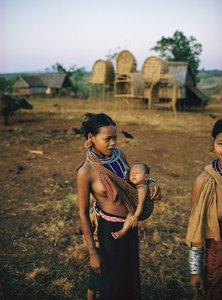 Khmer Loeu mother and her child in a sling and traditional hill tribe sarong in Phum