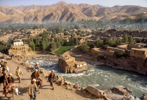 Tribesmen by Kokcha River passing through gorge in Faizabad, an Afghan provincial capital