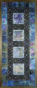 A Favrile glass tile panel, molded with flowers and geometric designs, 20th century