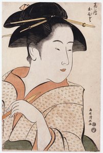 A bust portrait of Ohisa of the Takashimaya holding a tobacco pipe