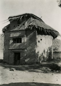 Square hut with thatched roof, Axum, Ethiopia by Ugo Monneret de Villard