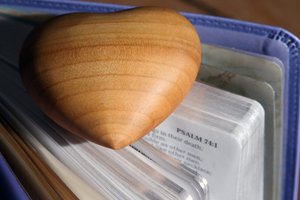 Carved Wood Heart on a Holy Bible