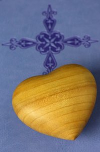 Carved Wood Heart on a Holy Bible