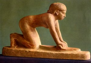 A woman grinding corn
