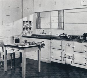 Aga Heat Ltd. The Model F Aga Cooker for a large house finished in black and cream vitreous enamel by Unbekannt
