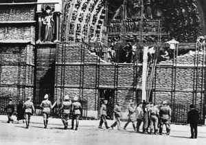 Clearing of sandbag protection from the facade of Notre Dame, German-occupied Paris
