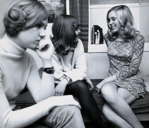 Fashion: Young Girls at a Party in Spain, One of the Women is Wearing a Very Short Dress