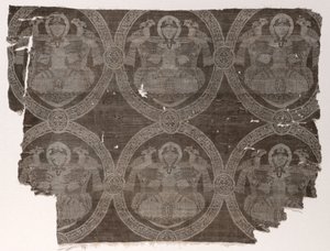 Lampas fragment with seated prince holding falcons in kufic medallions