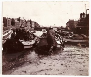 Man launching a fishing boat, Whitby Harbour, c 1901 by Unbekannt