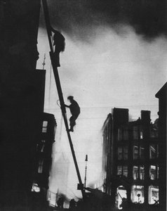 Out in the Blitz, Silhouetted Against the Light of Fires, Rescue Men Climb into a Building