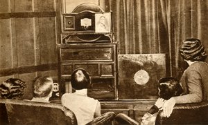 People watching an early television broadcast